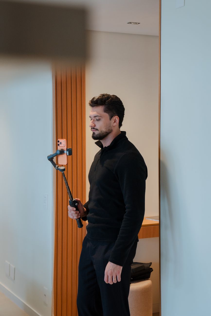 Creator filming content with a smartphone stabilizer